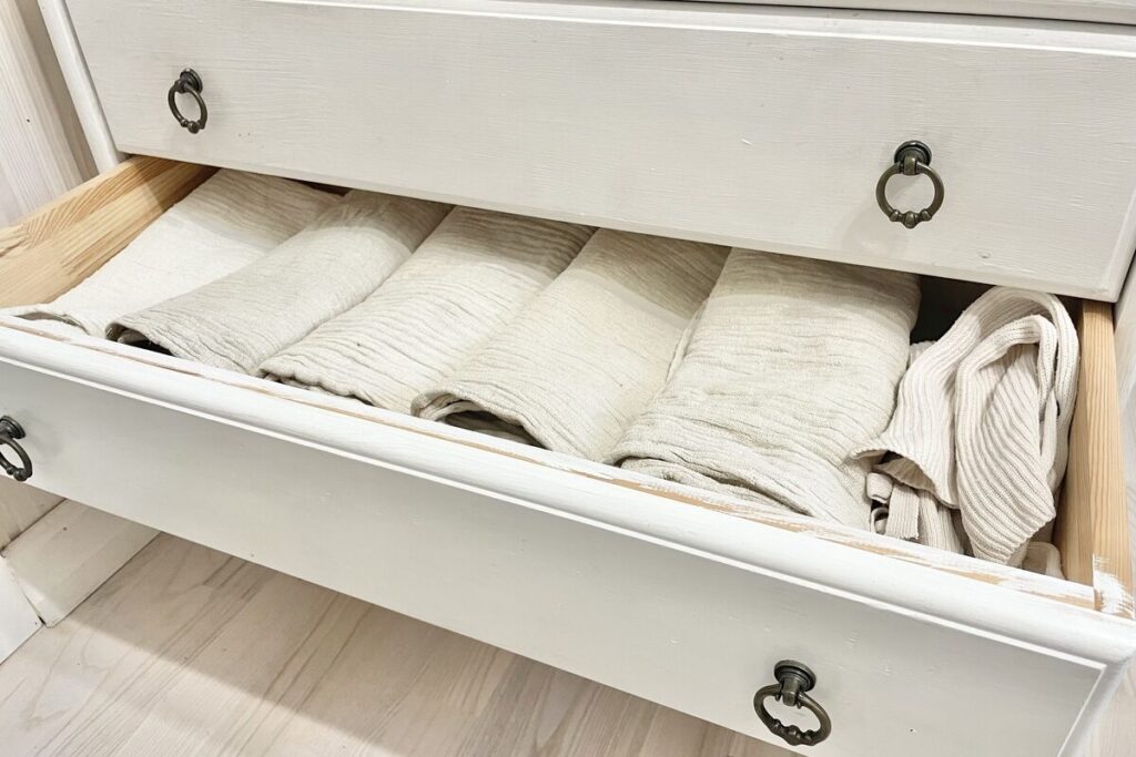 Flat cloth diapers in dresser.