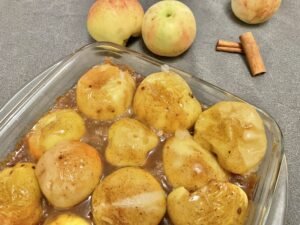 Baked apples on a baking pan.