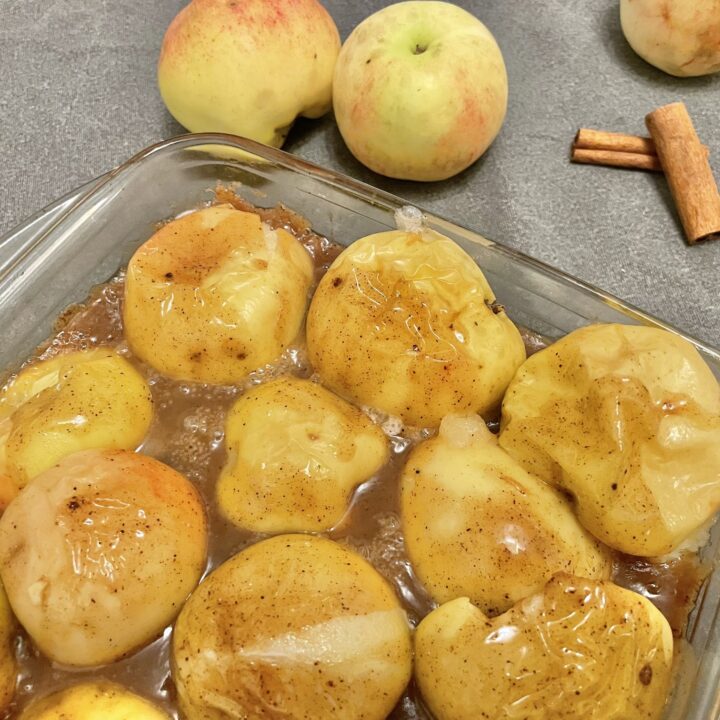 Baked apples on a baking pan.