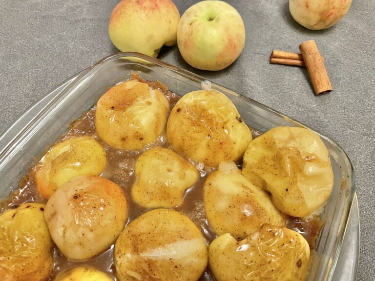 Baked apples on a baking pan.