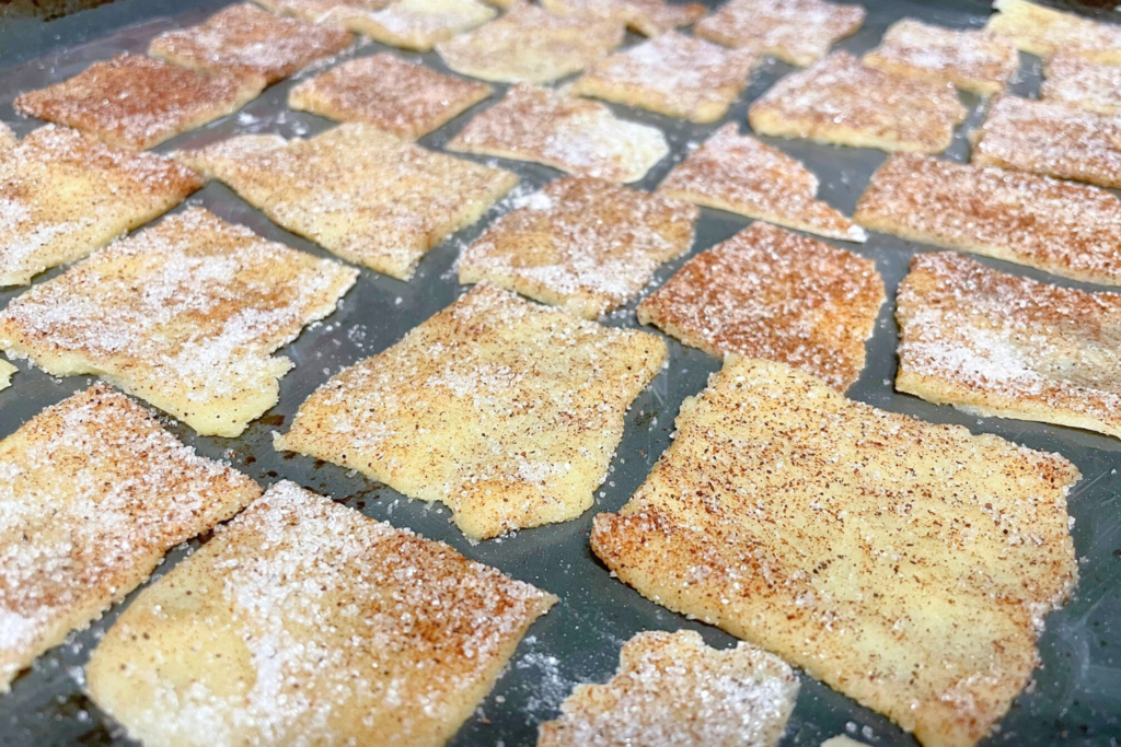 Cinnamon cookies on a baking pan.