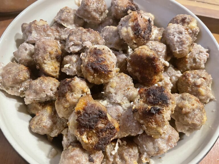 Cooked meatballs on a plate.