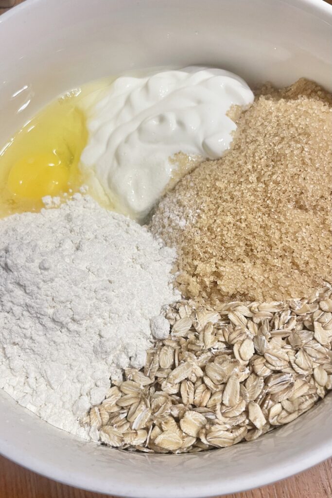 Oatmeal cookie ingredients in a bowl.